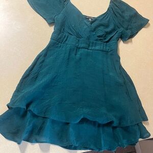 Green ruffled mini dress